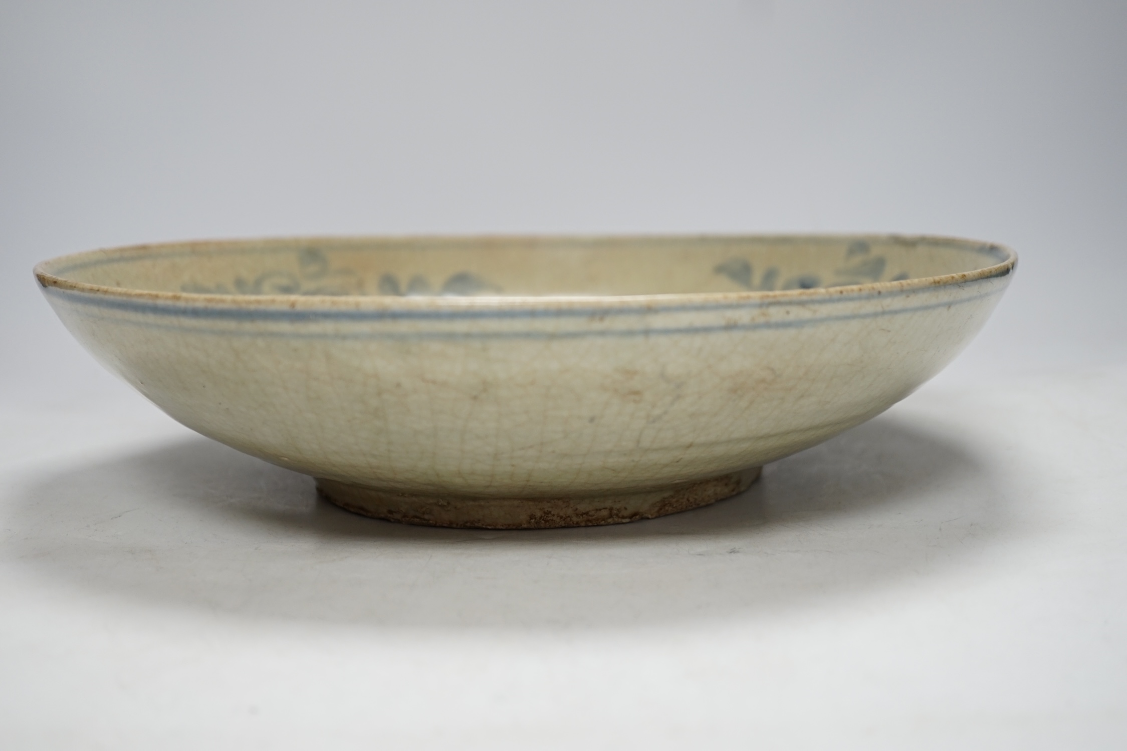 A Chinese Swatow blue and white dish, 17th century, 32cm diameter